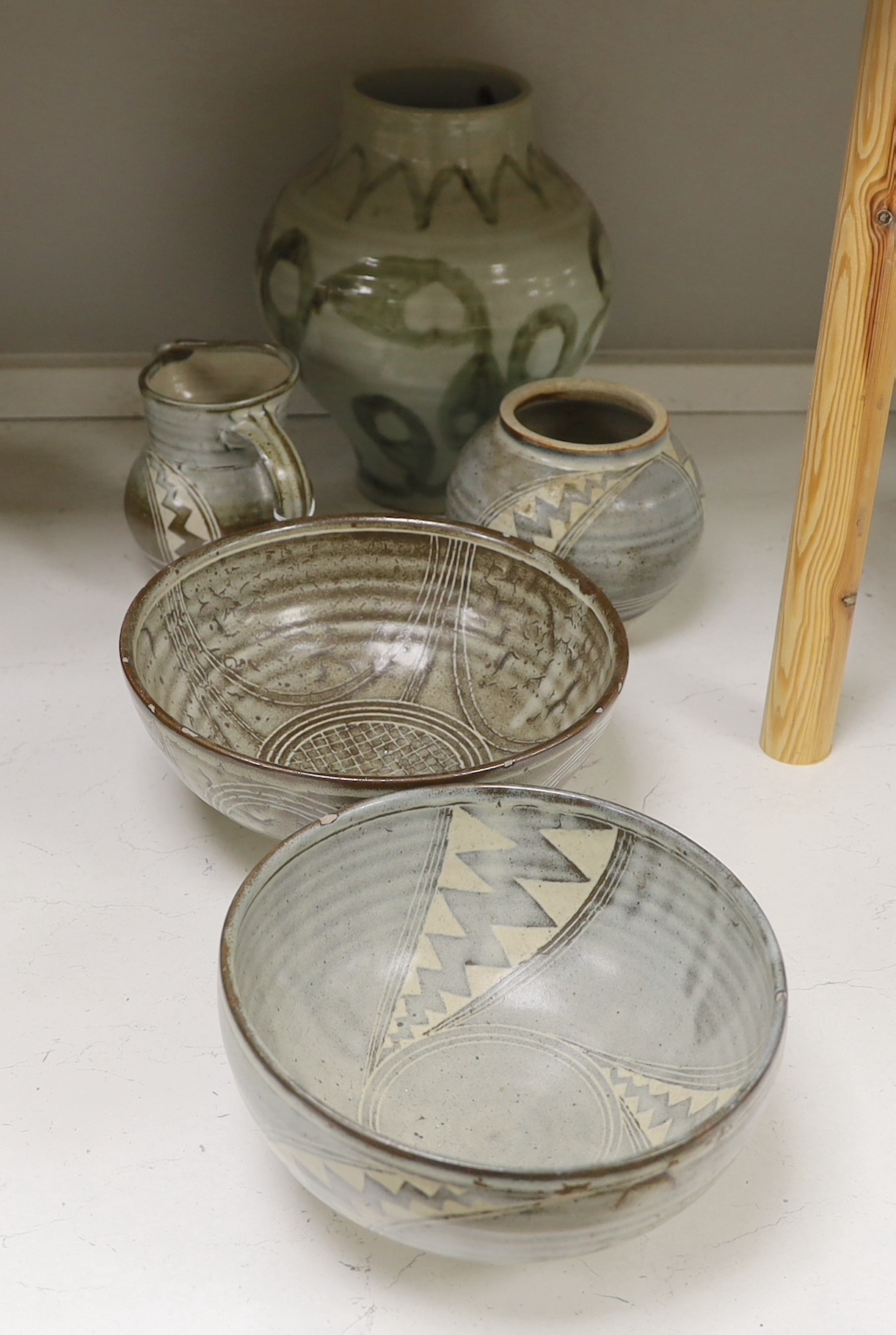 A 1961 Studio pottery vase and two bowls, a Studio pottery 'Gloucester' vase and a jug, largest 28cm high